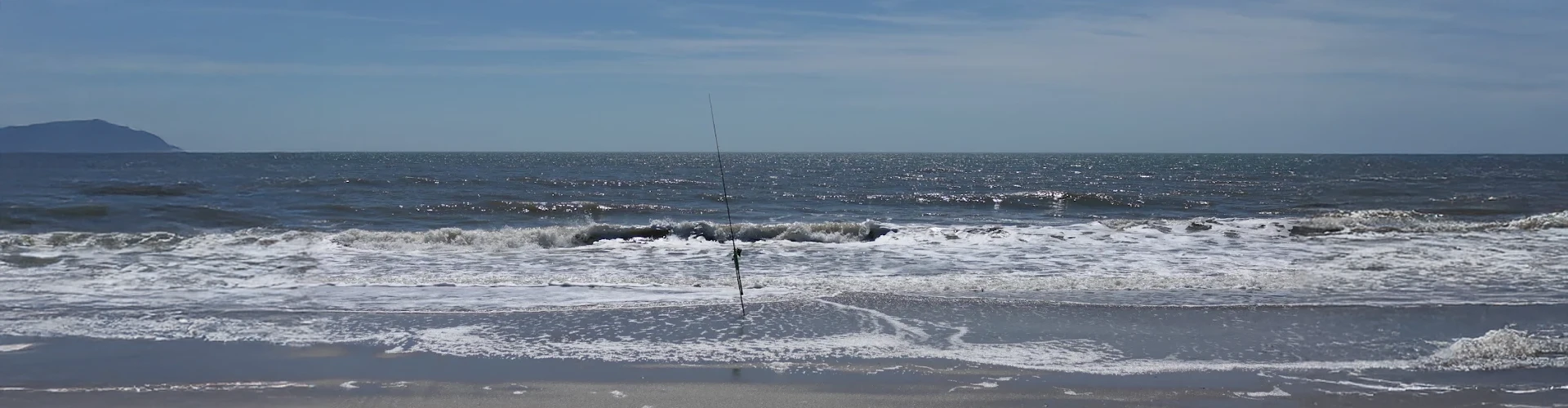 Waves crashing reflect coastal fishing supported by surf fishing gear rental Charleston from Charleston Fishing Rentals in Isle of Palms, South Carolina.