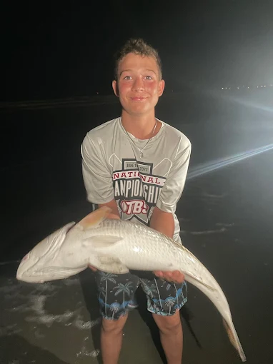 A large catch on the beach reflects shark fishing gear rental Charleston by Charleston Fishing Rentals in Isle of Palms, South Carolina.